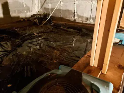 Air mover drying a crawl space under a raised-floor home