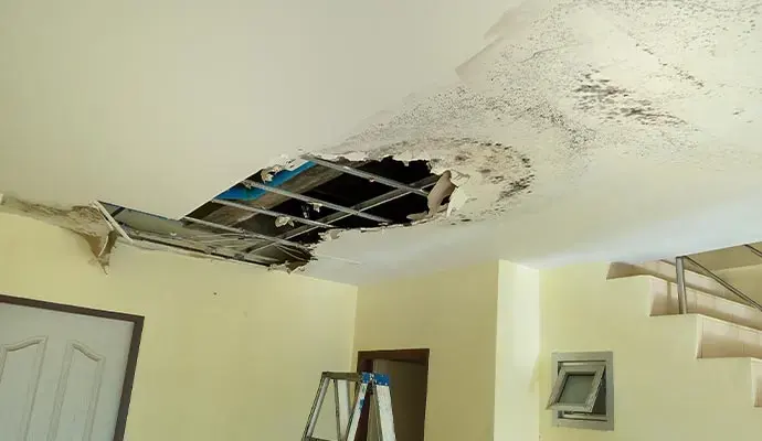 Ceiling drywall collapsed after winter rain came through the roof