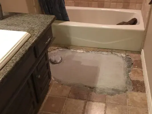 Bathroom slab opened to reach a leaking line under a La Puente home